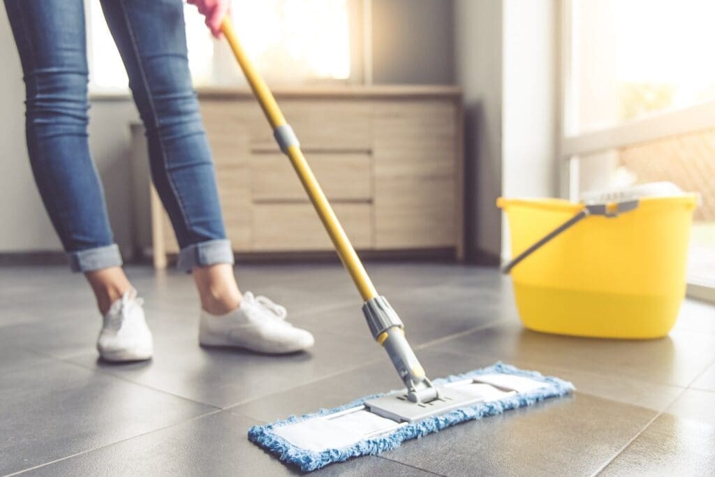 a person is cleaning floor