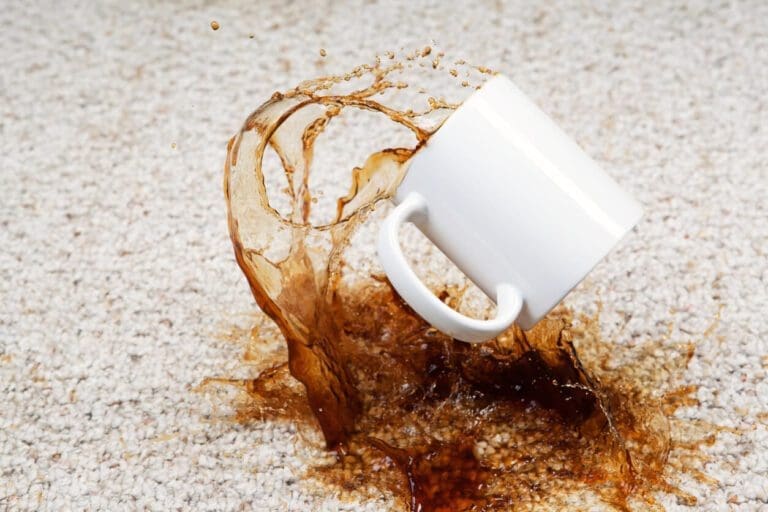 a cup of coffee dropped on carpet.