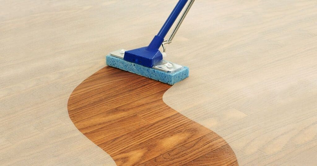 hardwood floor cleaning with a mop in progress.