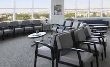 A larged carpeted waiting area