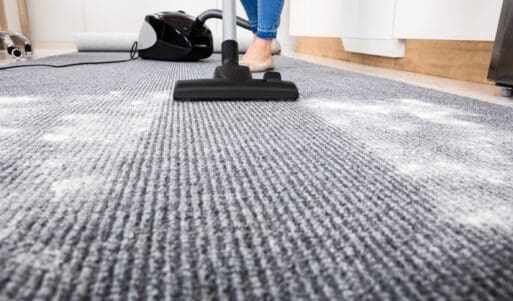 close shot of a vacuum cleaner on carpet.